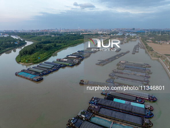 HUAI'AN, CHINA, on June 20, 2024, an aerial photo is showing a large number of ships waiting to be locked upstream of Huaian Lock on the Nor...