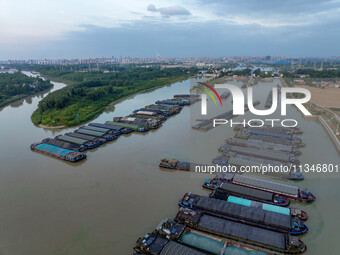 HUAI'AN, CHINA, on June 20, 2024, an aerial photo is showing a large number of ships waiting to be locked upstream of Huaian Lock on the Nor...