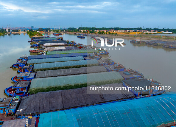 HUAI'AN, CHINA, on June 20, 2024, an aerial photo is showing a large number of ships waiting to be locked upstream of Huaian Lock on the Nor...