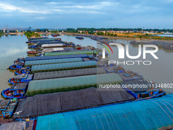 HUAI'AN, CHINA, on June 20, 2024, an aerial photo is showing a large number of ships waiting to be locked upstream of Huaian Lock on the Nor...