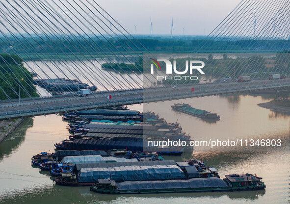 HUAI'AN, CHINA, on June 20, 2024, an aerial photo is showing a large number of ships waiting to be locked upstream of Huaian Lock on the Nor...