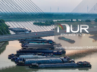 HUAI'AN, CHINA, on June 20, 2024, an aerial photo is showing a large number of ships waiting to be locked upstream of Huaian Lock on the Nor...