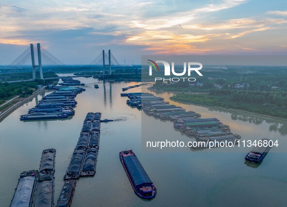 HUAI'AN, CHINA, on June 20, 2024, an aerial photo is showing a large number of ships waiting to be locked upstream of Huaian Lock on the Nor...