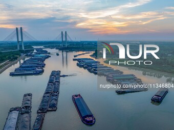 HUAI'AN, CHINA, on June 20, 2024, an aerial photo is showing a large number of ships waiting to be locked upstream of Huaian Lock on the Nor...