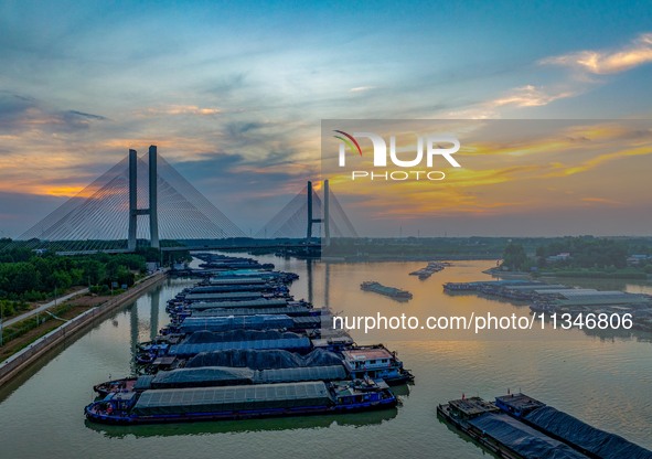 HUAI'AN, CHINA, on June 20, 2024, an aerial photo is showing a large number of ships waiting to be locked upstream of Huaian Lock on the Nor...