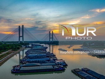 HUAI'AN, CHINA, on June 20, 2024, an aerial photo is showing a large number of ships waiting to be locked upstream of Huaian Lock on the Nor...