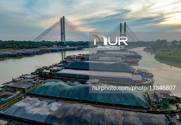 HUAI'AN, CHINA, on June 20, 2024, an aerial photo is showing a large number of ships waiting to be locked upstream of Huaian Lock on the Nor...