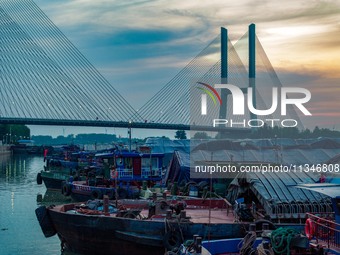 HUAI'AN, CHINA, on June 20, 2024, an aerial photo is showing a large number of ships waiting to be locked upstream of Huaian Lock on the Nor...