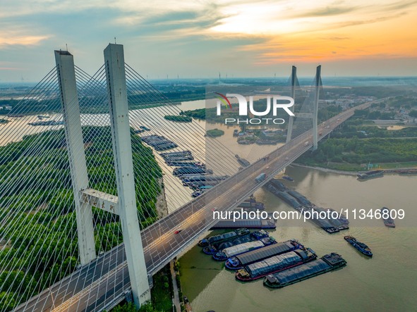 HUAI'AN, CHINA, on June 20, 2024, an aerial photo is showing a large number of ships waiting to be locked upstream of Huaian Lock on the Nor...