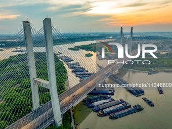 HUAI'AN, CHINA, on June 20, 2024, an aerial photo is showing a large number of ships waiting to be locked upstream of Huaian Lock on the Nor...