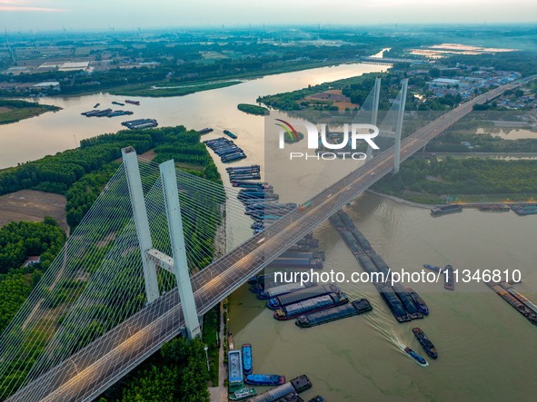 HUAI'AN, CHINA, on June 20, 2024, an aerial photo is showing a large number of ships waiting to be locked upstream of Huaian Lock on the Nor...