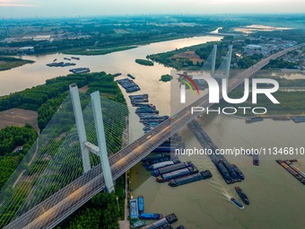 HUAI'AN, CHINA, on June 20, 2024, an aerial photo is showing a large number of ships waiting to be locked upstream of Huaian Lock on the Nor...