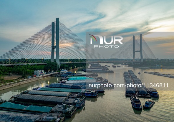 HUAI'AN, CHINA, on June 20, 2024, an aerial photo is showing a large number of ships waiting to be locked upstream of Huaian Lock on the Nor...