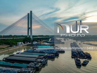 HUAI'AN, CHINA, on June 20, 2024, an aerial photo is showing a large number of ships waiting to be locked upstream of Huaian Lock on the Nor...