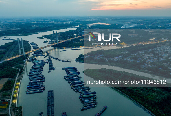 HUAI'AN, CHINA, on June 20, 2024, an aerial photo is showing a large number of ships waiting to be locked upstream of Huaian Lock on the Nor...