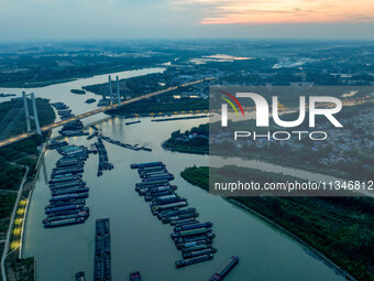 HUAI'AN, CHINA, on June 20, 2024, an aerial photo is showing a large number of ships waiting to be locked upstream of Huaian Lock on the Nor...