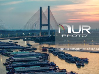 HUAI'AN, CHINA, on June 20, 2024, an aerial photo is showing a large number of ships waiting to be locked upstream of Huaian Lock on the Nor...