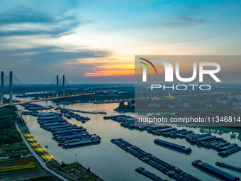 HUAI'AN, CHINA, on June 20, 2024, an aerial photo is showing a large number of ships waiting to be locked upstream of Huaian Lock on the Nor...