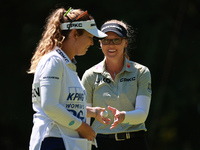 Brooke Henderson of Canada interacts with her caddy on the second green during Day One of the KPMG Women's PGA Championship at Sahalee Count...