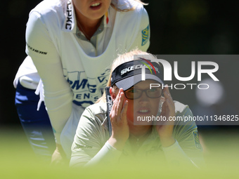 Brooke Henderson of Canada lines up her putt on the second green during Day One of the KPMG Women's PGA Championship at Sahalee Country Club...