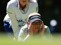 Brooke Henderson of Canada lines up her putt on the second green during Day One of the KPMG Women's PGA Championship at Sahalee Country Club...