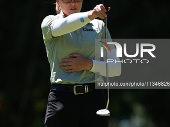 Brooke Henderson of Canada lines up her putt on the second green during Day One of the KPMG Women's PGA Championship at Sahalee Country Club...