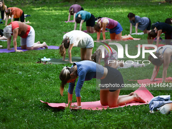 A day ahead of International Yoga Day particpants attend free outdoor yoga classes in Bednarski Park in Krakow, Poland on June 20th. 2024....