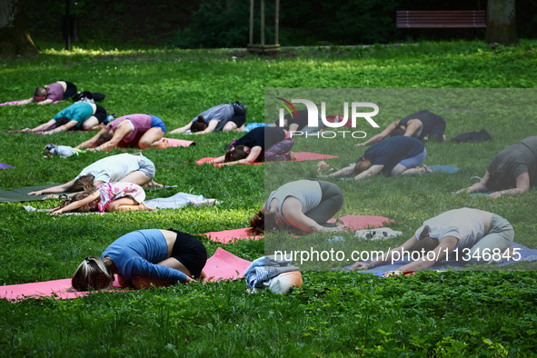 A day ahead of International Yoga Day particpants attend free outdoor yoga classes in Bednarski Park in Krakow, Poland on June 20th. 2024.  