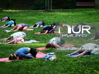 A day ahead of International Yoga Day particpants attend free outdoor yoga classes in Bednarski Park in Krakow, Poland on June 20th. 2024....