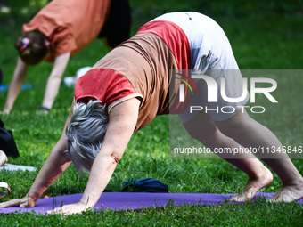 A day ahead of International Yoga Day particpants attend free outdoor yoga classes in Bednarski Park in Krakow, Poland on June 20th. 2024....