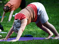 A day ahead of International Yoga Day particpants attend free outdoor yoga classes in Bednarski Park in Krakow, Poland on June 20th. 2024....