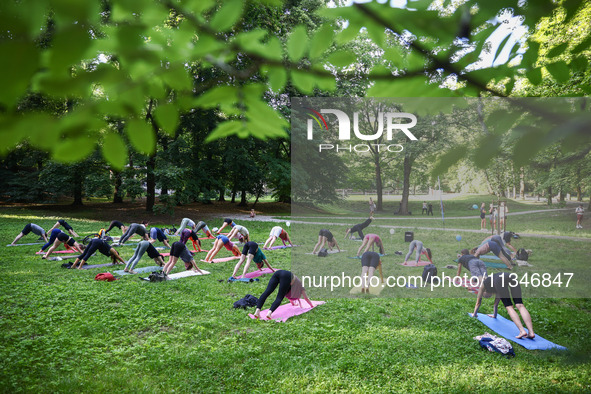 A day ahead of International Yoga Day particpants attend free outdoor yoga classes in Bednarski Park in Krakow, Poland on June 20th. 2024.  