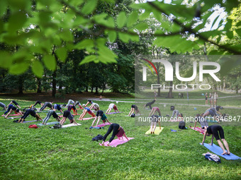 A day ahead of International Yoga Day particpants attend free outdoor yoga classes in Bednarski Park in Krakow, Poland on June 20th. 2024....