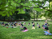 A day ahead of International Yoga Day particpants attend free outdoor yoga classes in Bednarski Park in Krakow, Poland on June 20th. 2024....