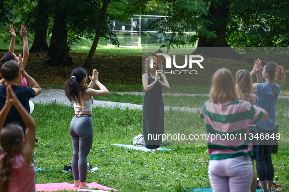 A day ahead of International Yoga Day particpants attend free outdoor yoga classes in Bednarski Park in Krakow, Poland on June 20th. 2024.  