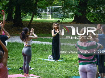 A day ahead of International Yoga Day particpants attend free outdoor yoga classes in Bednarski Park in Krakow, Poland on June 20th. 2024....