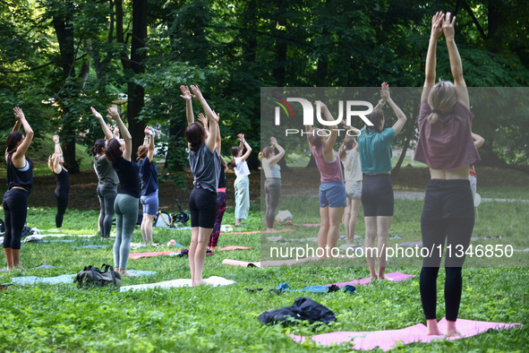 A day ahead of International Yoga Day particpants attend free outdoor yoga classes in Bednarski Park in Krakow, Poland on June 20th. 2024.  