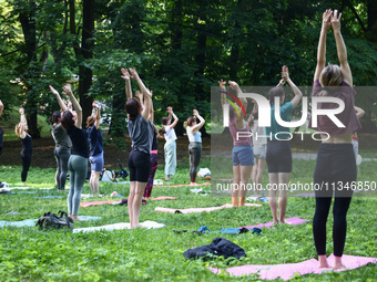 A day ahead of International Yoga Day particpants attend free outdoor yoga classes in Bednarski Park in Krakow, Poland on June 20th. 2024....