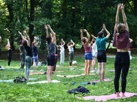 A day ahead of International Yoga Day particpants attend free outdoor yoga classes in Bednarski Park in Krakow, Poland on June 20th. 2024....