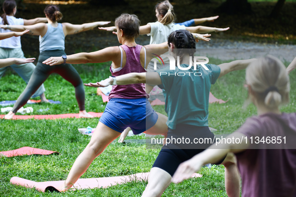 A day ahead of International Yoga Day particpants attend free outdoor yoga classes in Bednarski Park in Krakow, Poland on June 20th. 2024.  