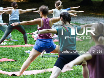 A day ahead of International Yoga Day particpants attend free outdoor yoga classes in Bednarski Park in Krakow, Poland on June 20th. 2024....