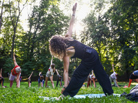 A day ahead of International Yoga Day particpants attend free outdoor yoga classes in Bednarski Park in Krakow, Poland on June 20th. 2024....