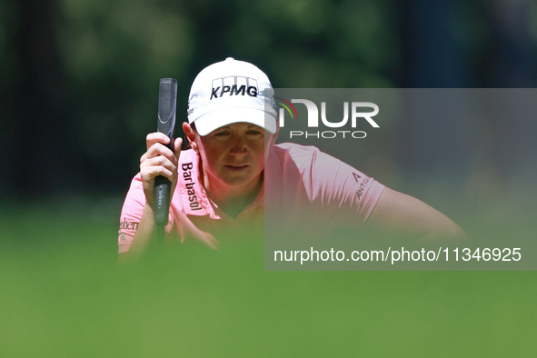 Stacy Lewis of the United States lines up her putt on the second green during Day One of the KPMG Women's PGA Championship at Sahalee Countr...