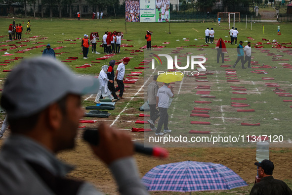 Heavy rainfall is delaying the 10th Yoga Day Celebrations in Baramulla, Jammu and Kashmir, India, on June 21, 2024. PM Modi is leading celeb...