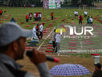 Heavy rainfall is delaying the 10th Yoga Day Celebrations in Baramulla, Jammu and Kashmir, India, on June 21, 2024. PM Modi is leading celeb...