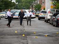 Shell casings are being recovered at the crime scene. A 19-year-old male victim is being shot and killed in Chicago, Illinois, United States...