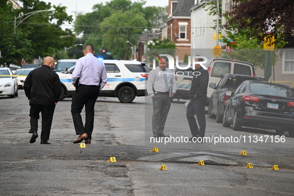 Shell casings are being recovered at the crime scene. A 19-year-old male victim is being shot and killed in Chicago, Illinois, United States...