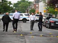 Shell casings are being recovered at the crime scene. A 19-year-old male victim is being shot and killed in Chicago, Illinois, United States...