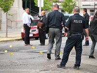 Shell casings are being recovered at the crime scene. A 19-year-old male victim is being shot and killed in Chicago, Illinois, United States...