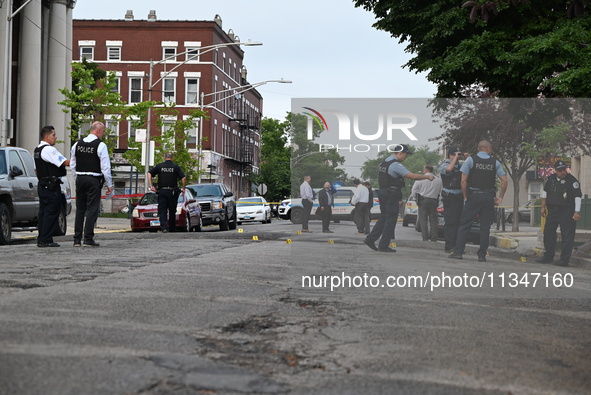 Shell casings are being recovered at the crime scene. A 19-year-old male victim is being shot and killed in Chicago, Illinois, United States...